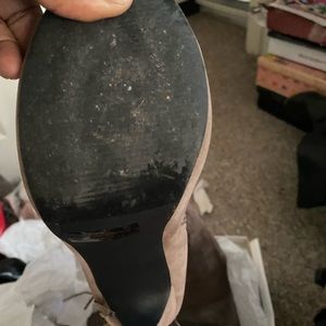 Thigh high suede high heel open toe boots with tassels.